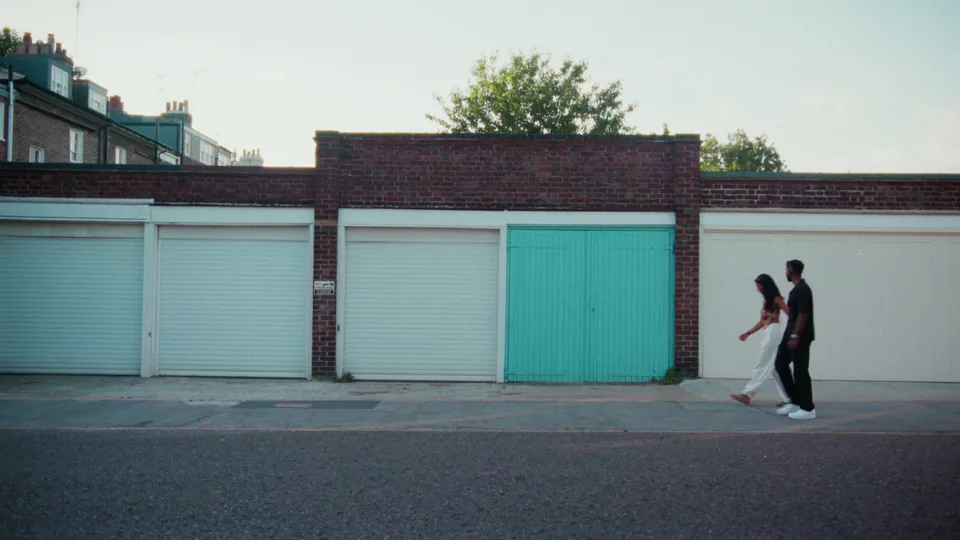 The couple passing the garages, Notting Hill — FaceTime music video