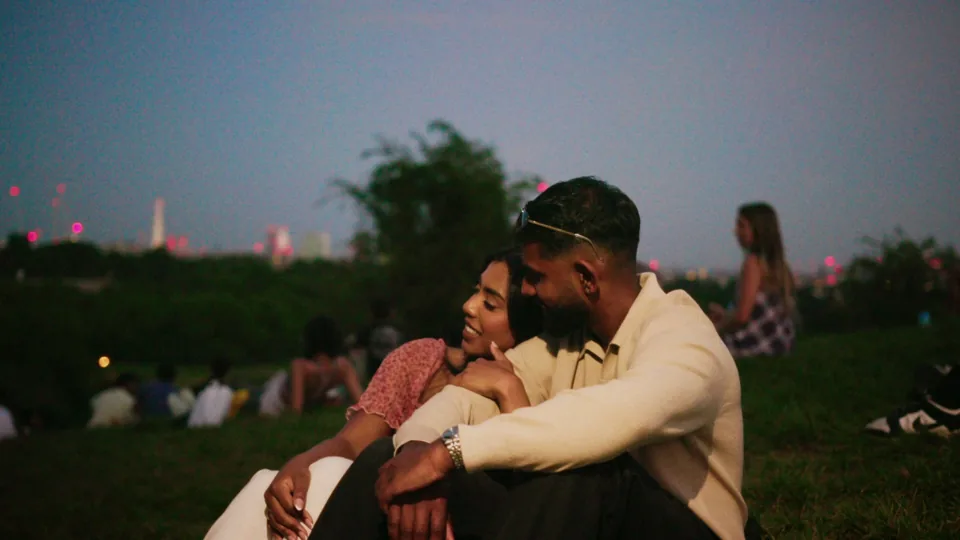 The couple on Primrose Hill at night, London skyline behind — FaceTime music video