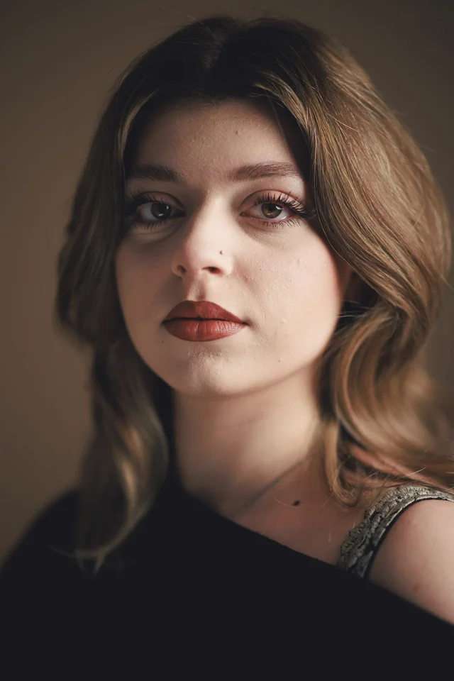 A real photo of a real person, taken in a studio session